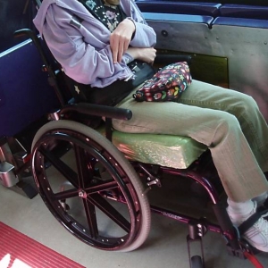 wheelchair tied down on bus