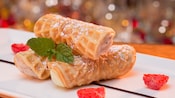 Cannolis served with berries